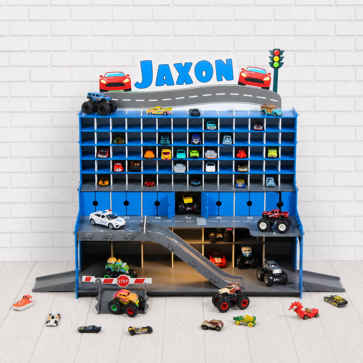 Two personalized wooden toy car garages for siblings — different finishes, different names, no territory conflict