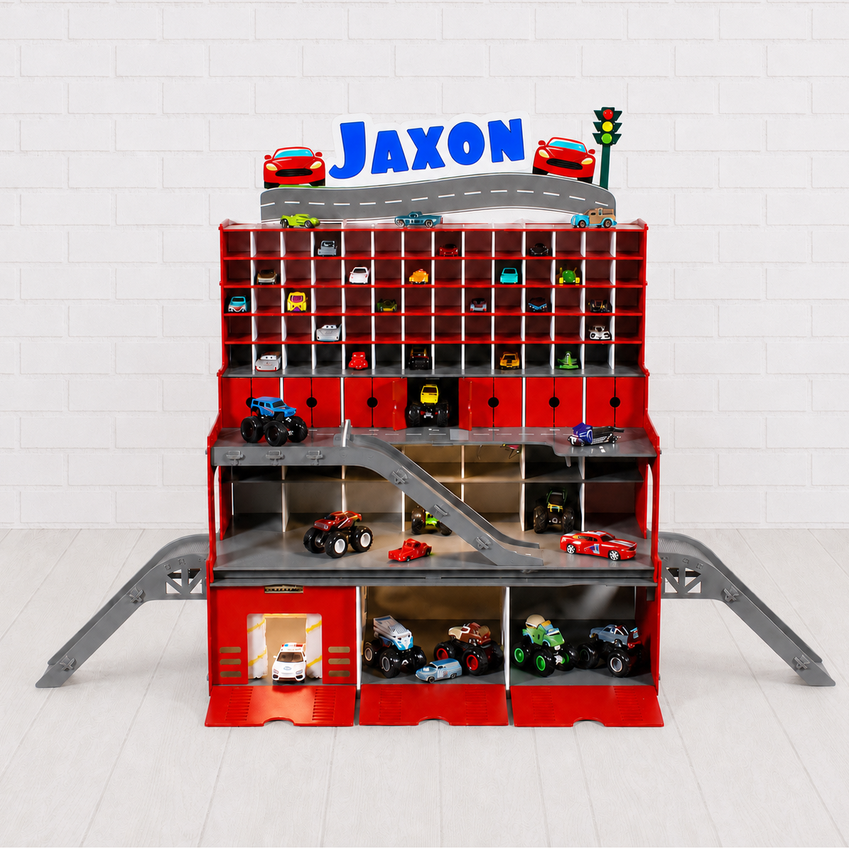 Toy car garage with multiple levels and toy cars on a white background