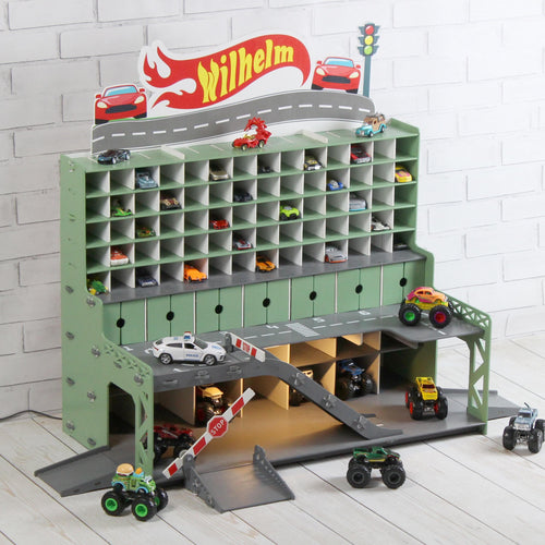 Angled front view of wooden toy car garage with ramps, display shelves and LED lights