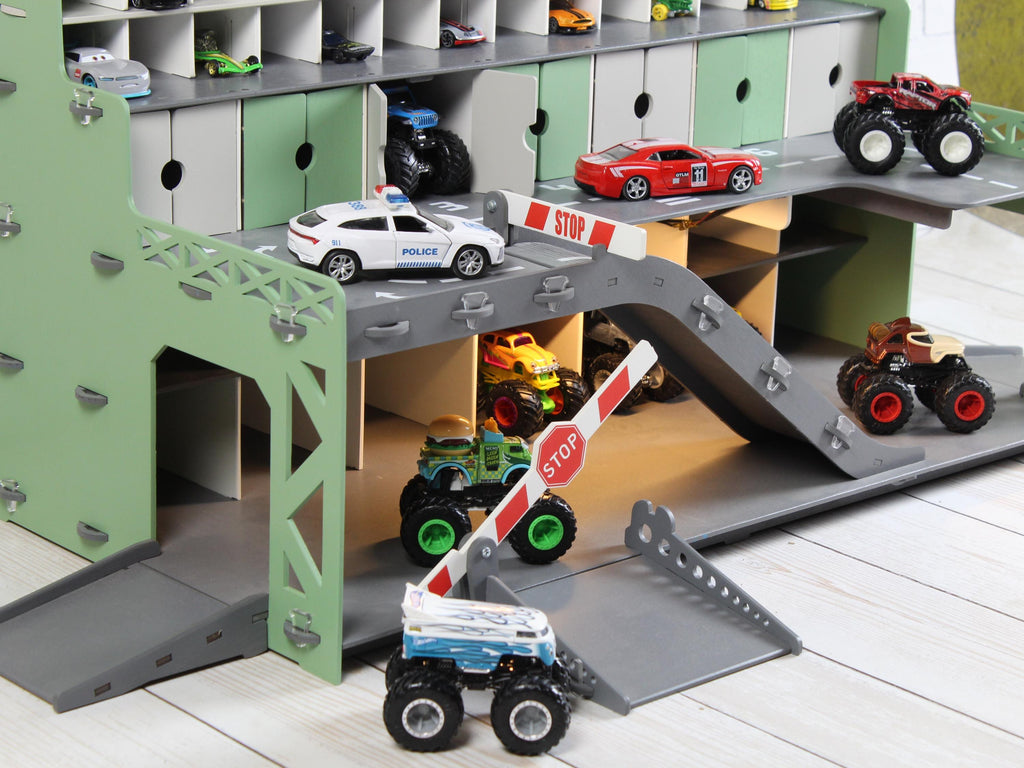 Side detail view of mint toy car garage with ramp, parking doors and toy cars