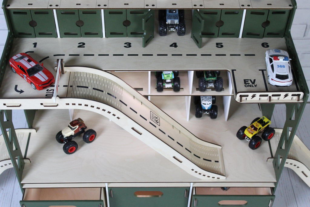 Toy race track set with multiple toy cars for hot wheels