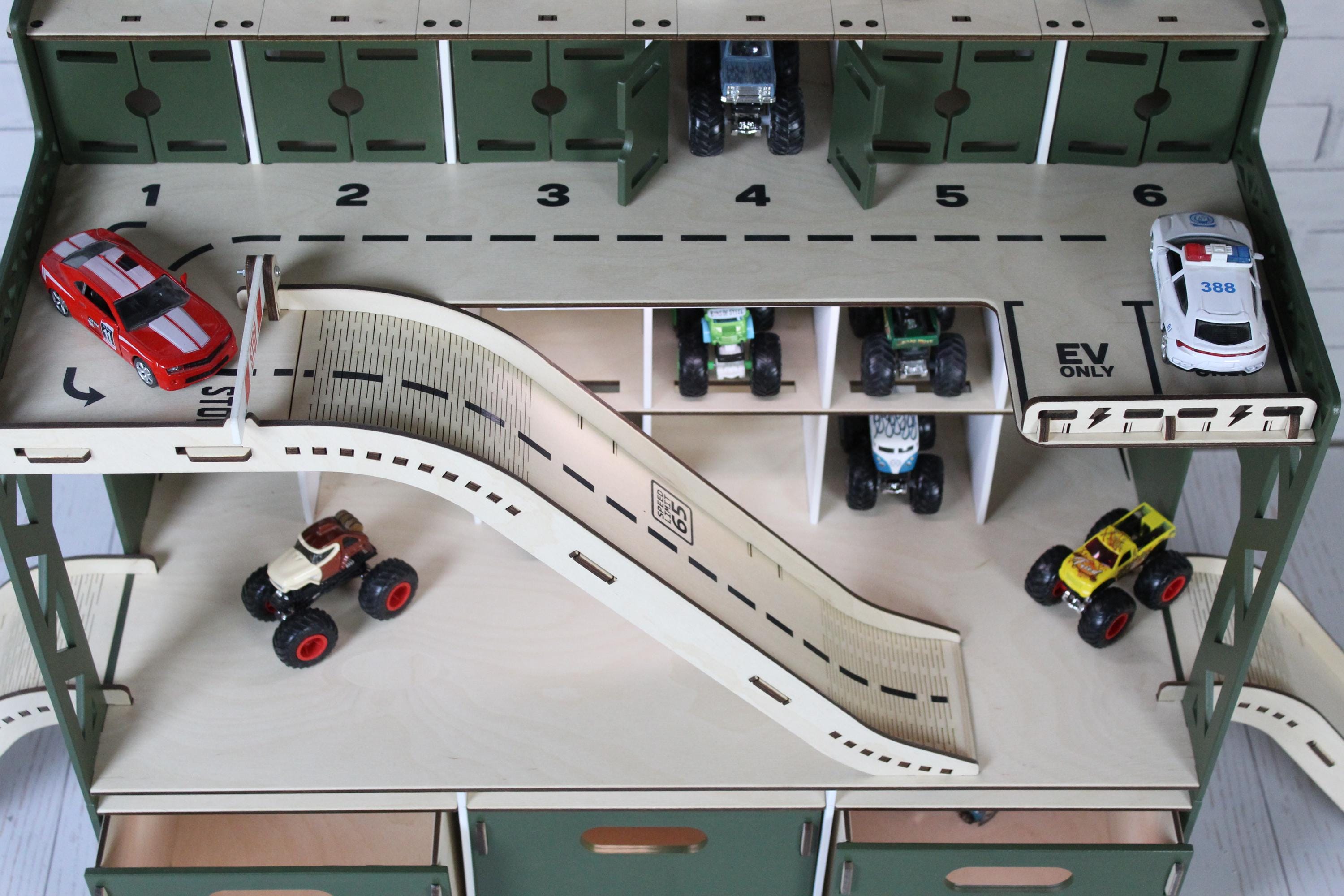 Toy race track set with multiple toy cars for hot wheels