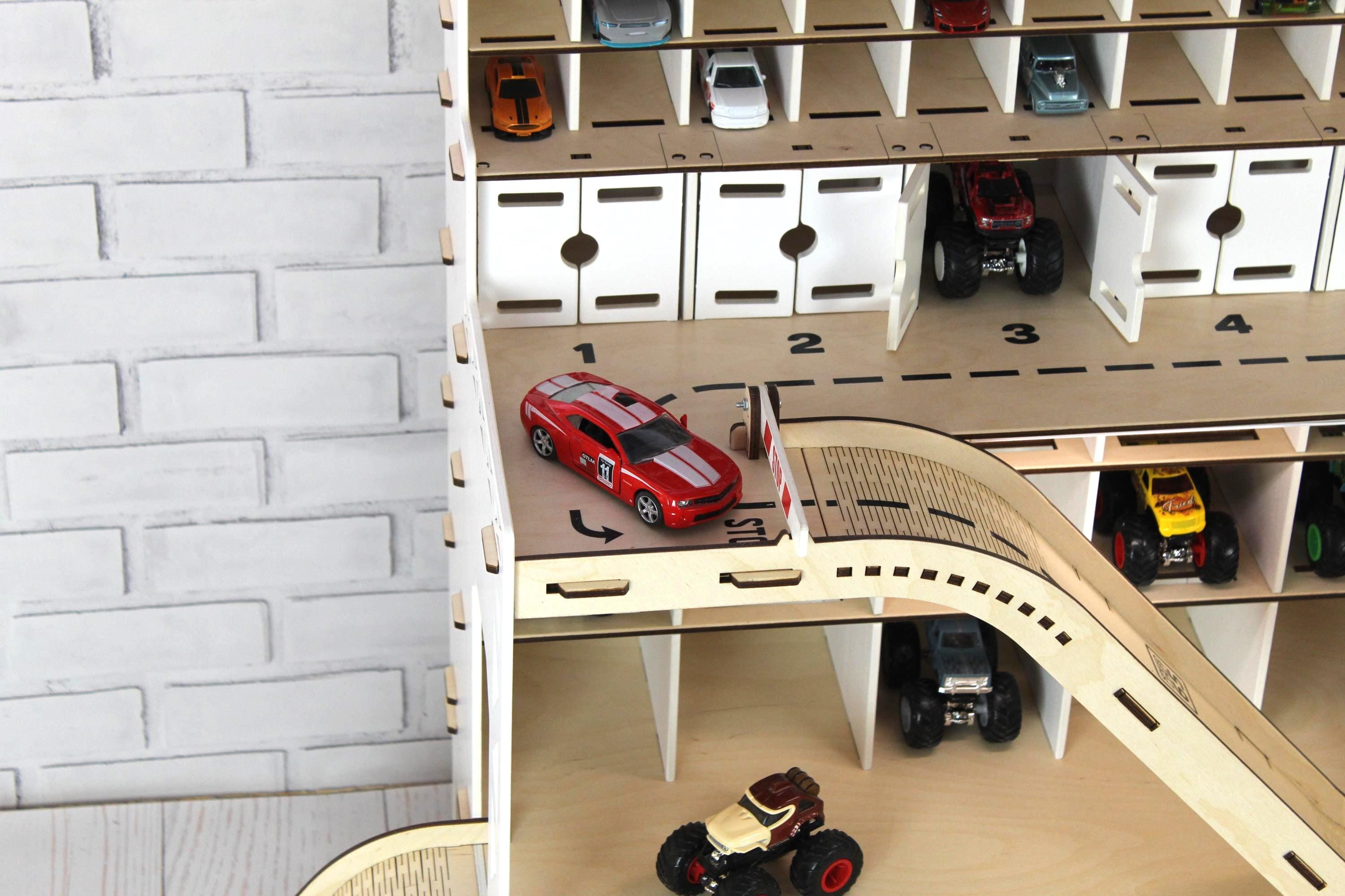 White toy car garage close-up with ramp, parking spaces and garage doors