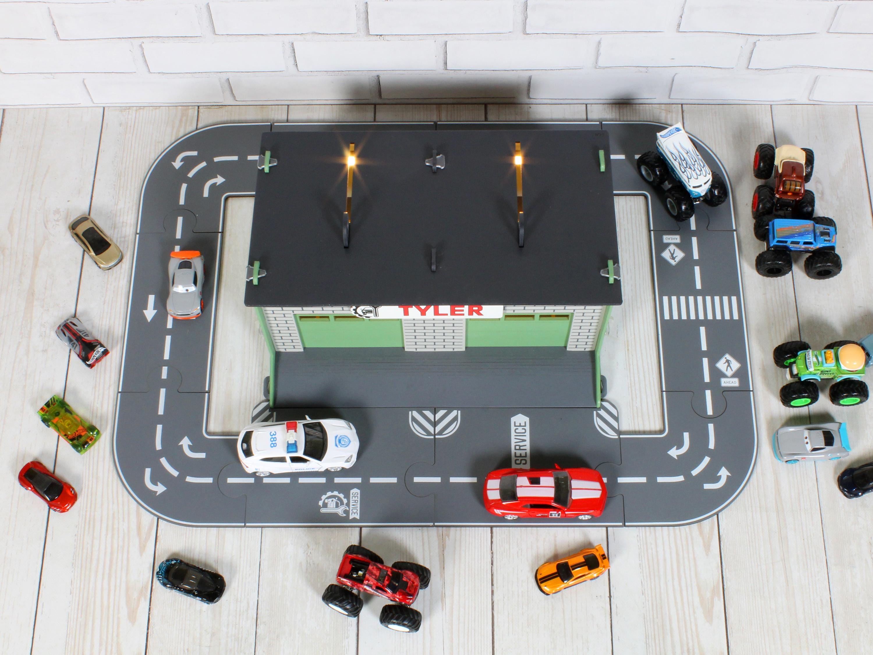 Top view of wooden toy car garage with circular road layout and parking area