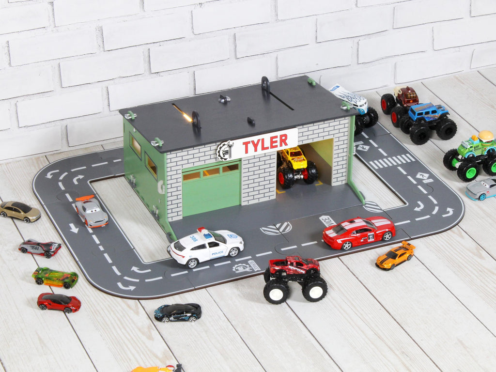 Full angled view of wooden toy car garage with round road track and 1:64 cars