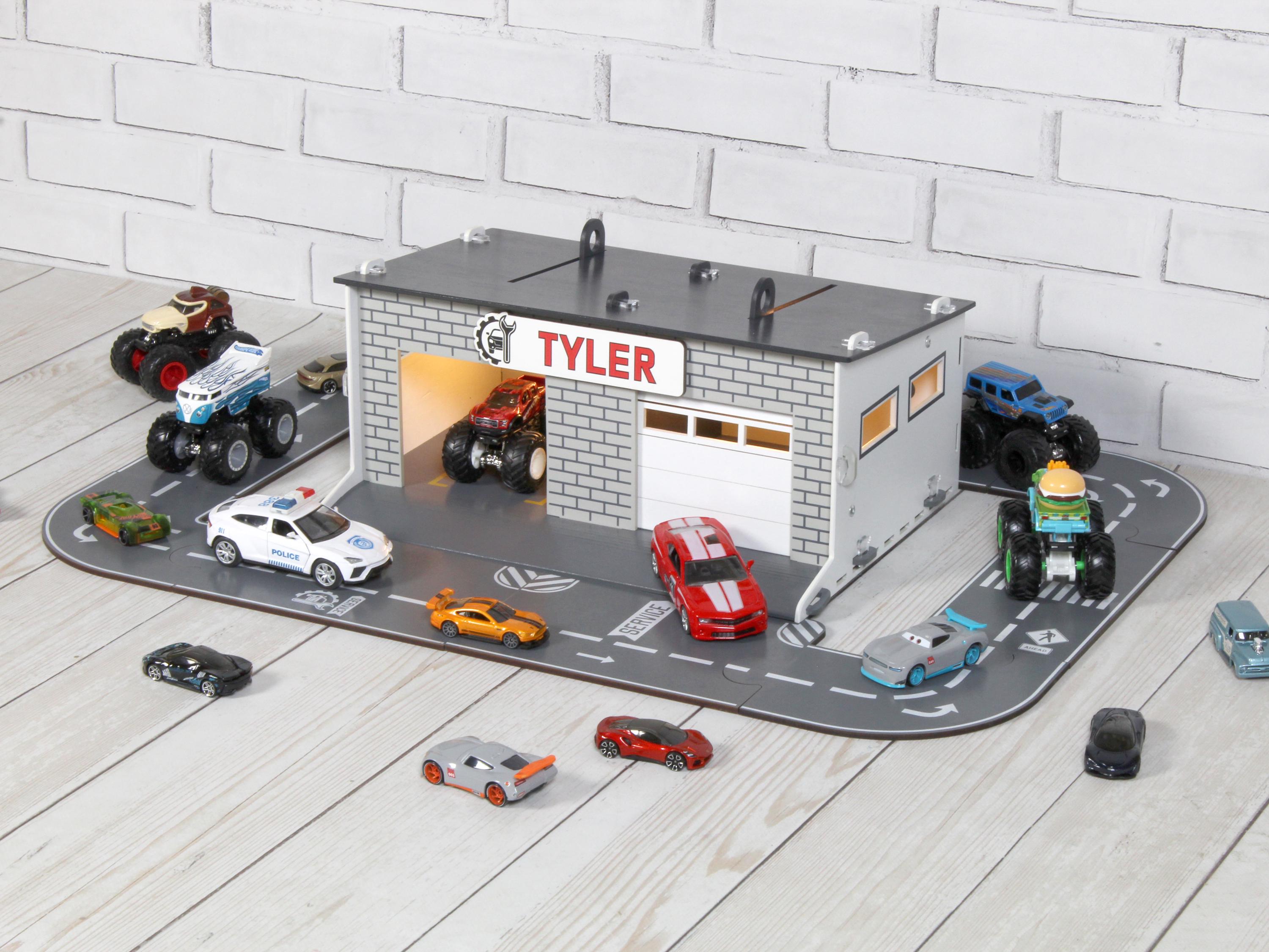 Angled side view of wooden toy car garage with round road playset and toy cars