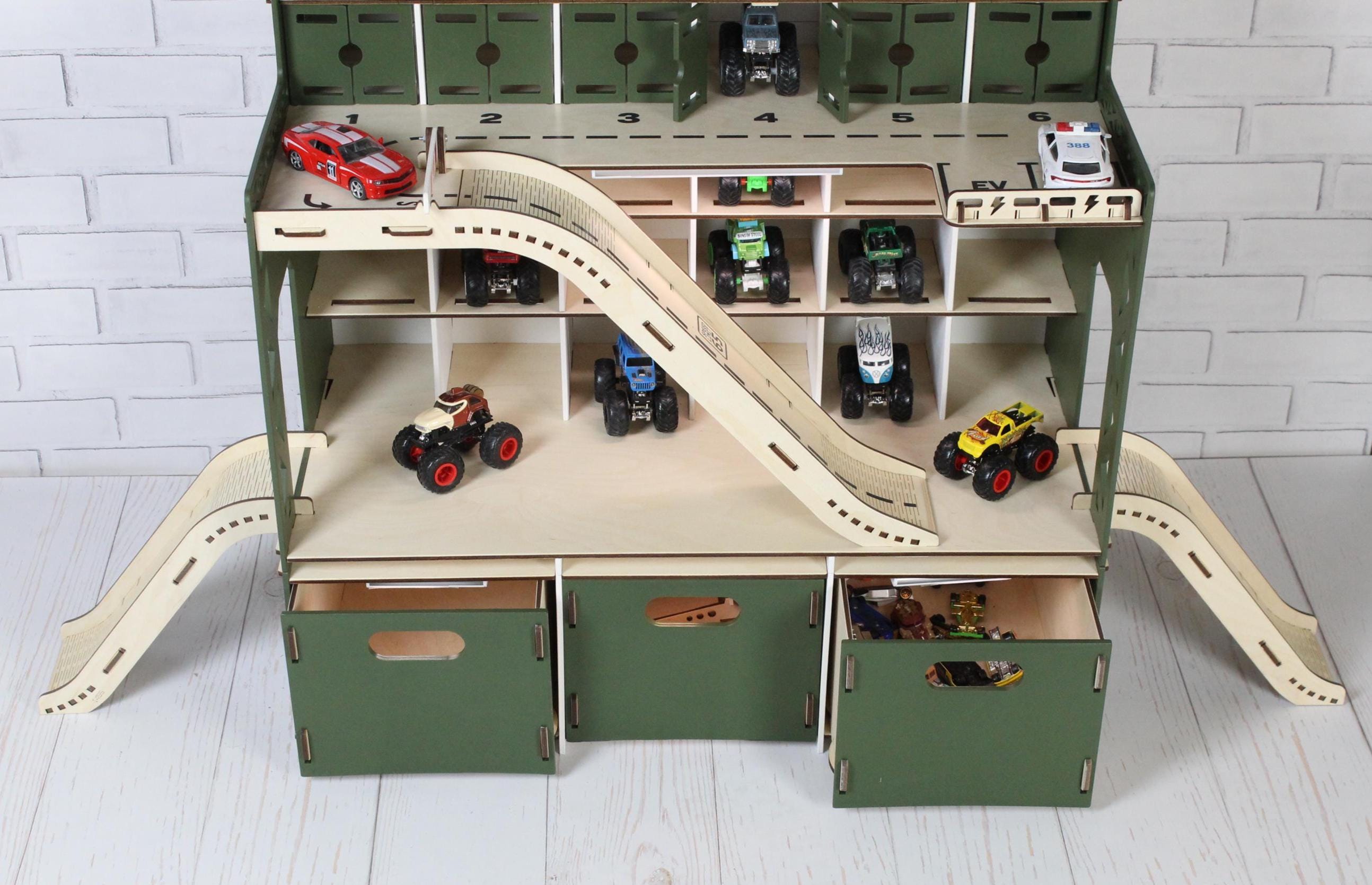 Wooden toy car garage close-up with ramps, parking spaces and car wash section, bottom drawers
