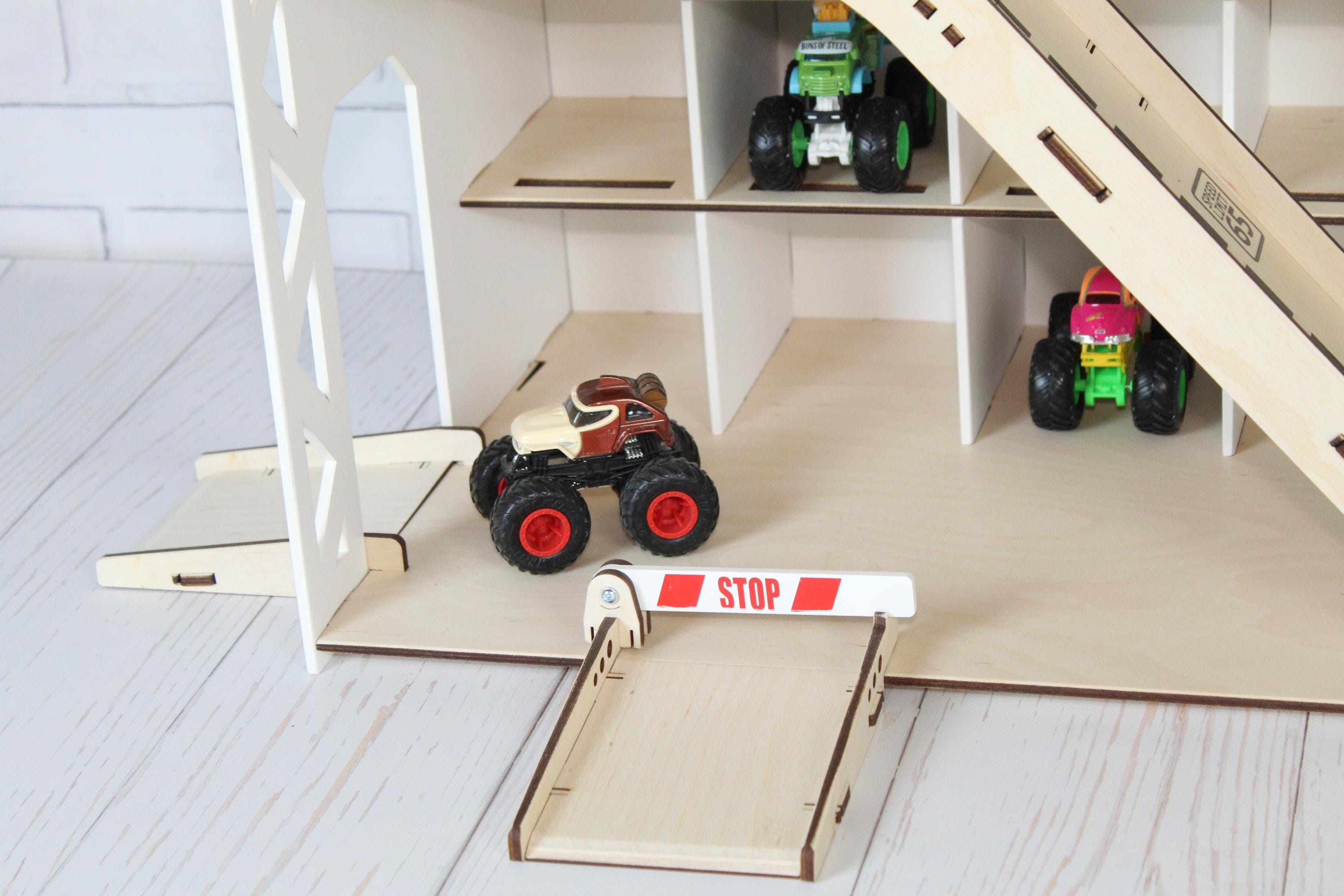 Wooden toy car garage with ramps, open parking shelves, stop sign