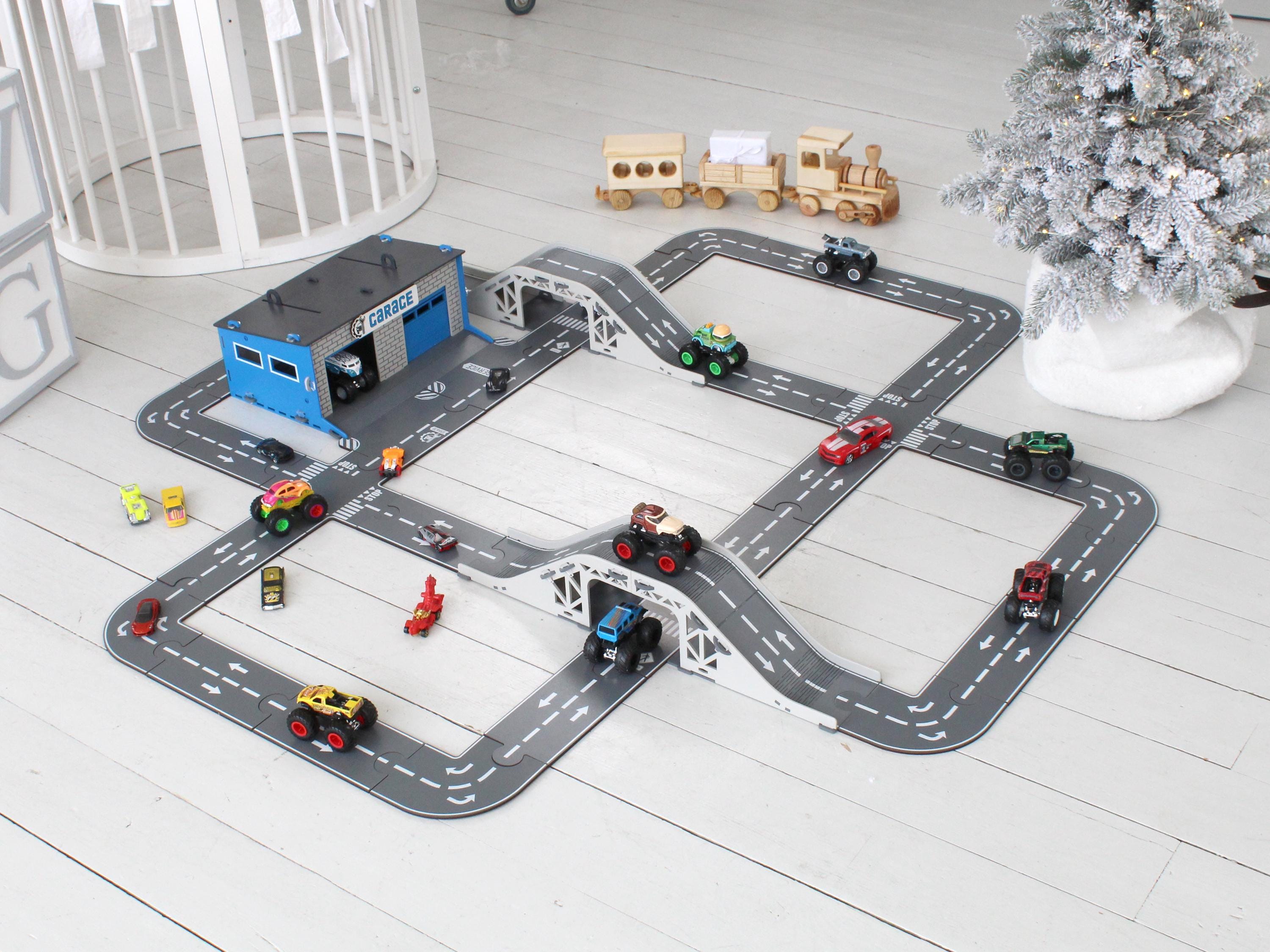 Side view of olive wooden toy car garage with ramp, shelves and Benson’s Garage nameplate