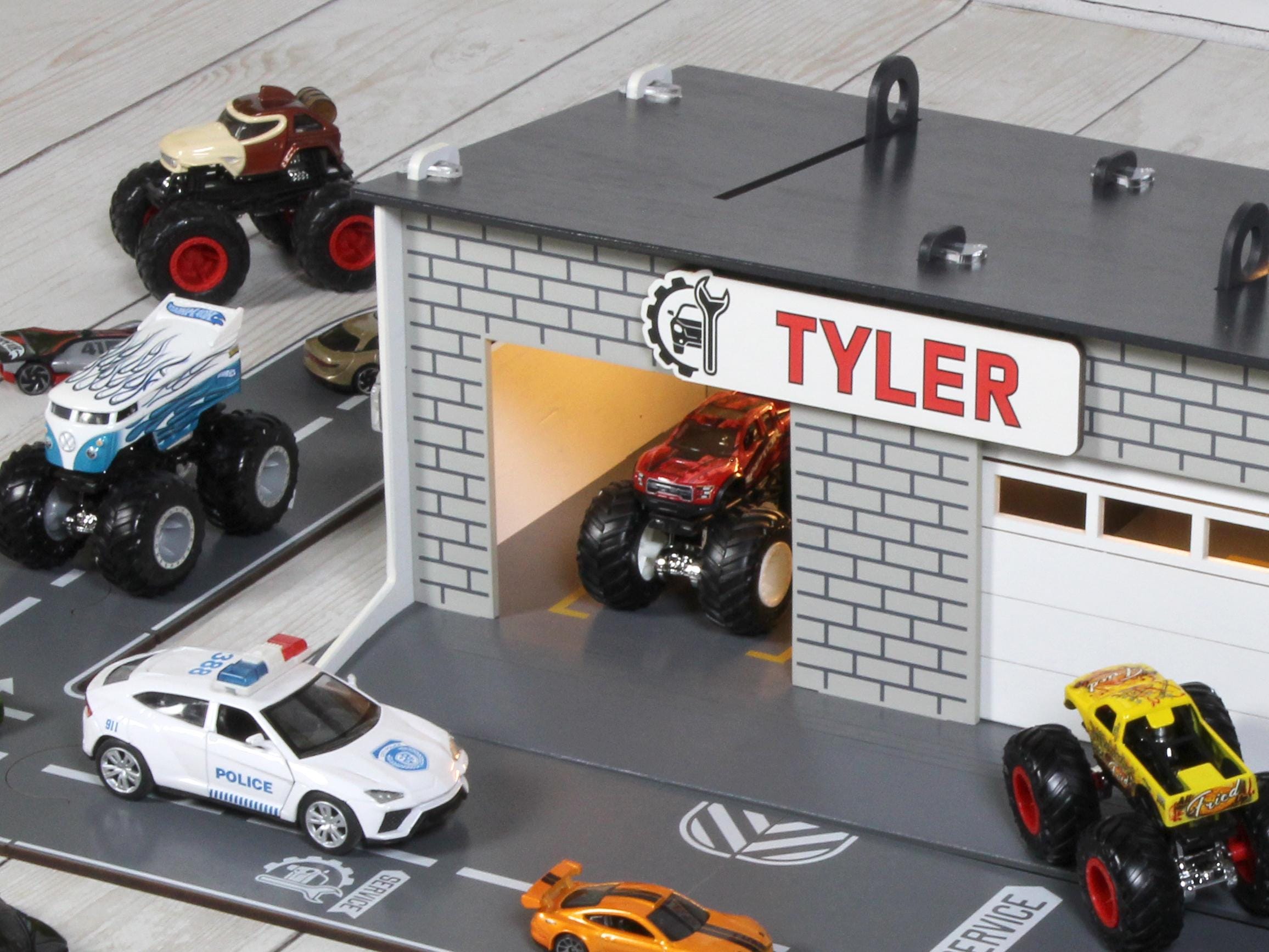 Close-up front view of toy car garage with custom Tyler nameplate and open door